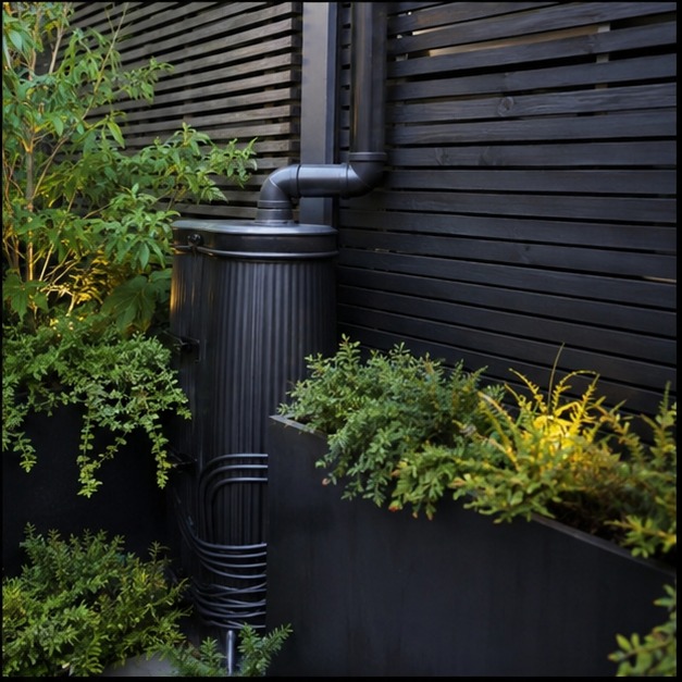 Slatted timber planter in a courtyard garden